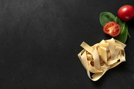 raw paste pappardelle on a dark background.の写真素材
