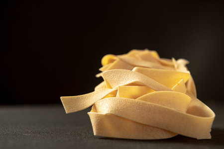 raw paste Pappardelle close-up. traditional Italian pastaの写真素材
