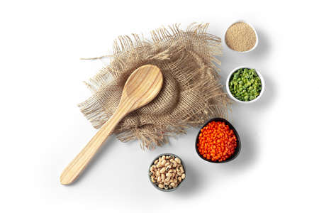 Superfood on a white background. Set from Ancient grain food top view. Healthy eating. Alternative to staple foods. Gluten free. Green peas, millet, amaranth, lentils, black eye beans on plates arranged around. Top view and flat layの写真素材