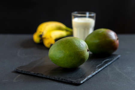 Ingredients for making mango fruit yogurt. Lassi drink preparation.の写真素材