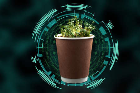 the smart farm. the concept of agriculture of today and the future. Eco cup with green vapors with computer graphics on a black backgroundの写真素材