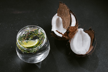 Alcoholic cocktail hard seltzer with coconut on black backgroundの写真素材