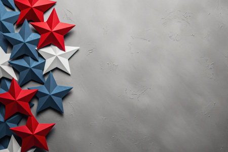 Five pointed stars of american flag colors on gray light cement background. Patriot's Day. free space for text For your design.の素材