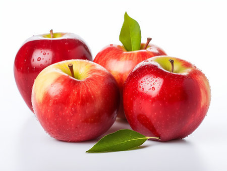 Red apples with green leaves isolated on white background. Close up.の素材