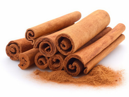 Cinnamon sticks and powder isolated on white background cutout. Cinnamon sticks and powderの素材
