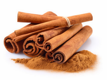 cinnamon sticks and powder isolated on white background close up macro.の素材