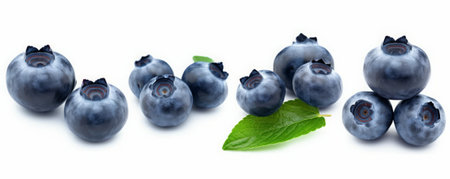 Blueberries with leaves isolated on white background closeup. Set or collectionの素材