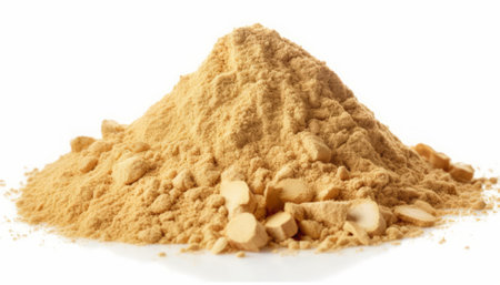 Heap of ginger powder isolated on white background. Healthy food.の素材