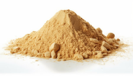 Pile of ground ginger powder isolated on white background, studio shotの素材