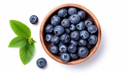 Fresh blueberries in bowl isolated on white background. Top view.の素材