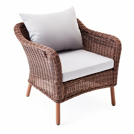 Wicker rattan armchair with pillows isolated on white backgroundの素材