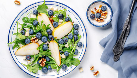 Healthy salad with pear, blueberry, walnuts and arugula.の素材