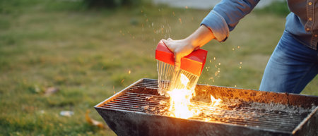 Woman roasting marshmallows on a barbecue grill in the gardenの素材