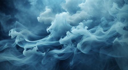 Blue cloud of smoke on a black background. Shallow depth of field.の素材