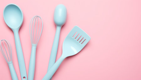 Kitchen utensils on pastel pink background, top viewの素材