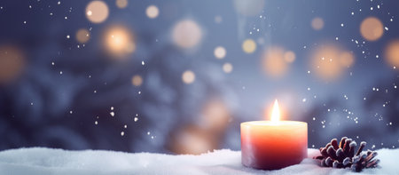 Christmas background with burning candle on snow and falling snowflakes.の素材