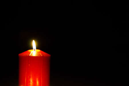 Candle in the darkの写真素材