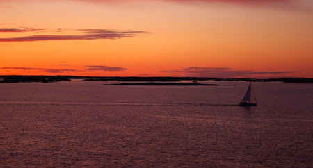 The sun setting over the islands in Baltic seaの写真素材