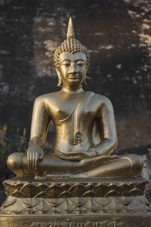 Golden Buddha statue at buddhist temple, Chiang Mai, Thailand