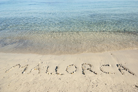 Inscription on the beach of Mediterranean sea, Mallorca, Spainの写真素材
