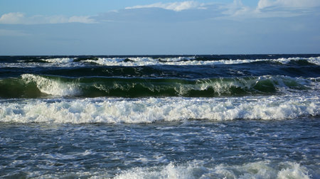 Sea waves runing on the beach of Baltic sea