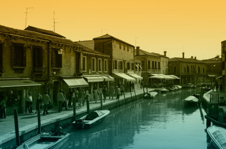 VENICE, Italy - OCTOBER 06: Quay of Murano island on October 06, 2011 Venice, Italy. One of beautiful medieval venetian canals on Murano island のeditorial素材