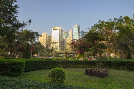 HONG KONG - MARCH 05: People relaxing at city park on March 05, 2013 in Hong Kong. Hong Kong is an international financial centre that has 112 buildings that stand taller than 180 metresのeditorial素材