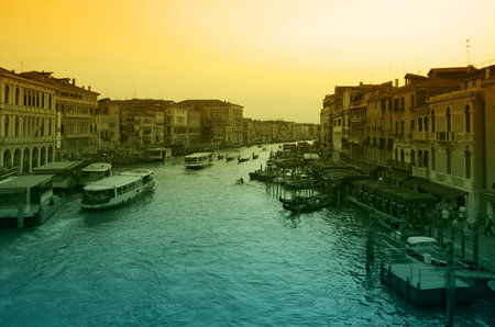 VENICE, Italy - OCTOBER 06: Grand canal at sunset on October 06, 2011 Venice, Italy. One of beautiful medieval venetian canals, attracting thousands tourists from all over the worldのeditorial素材