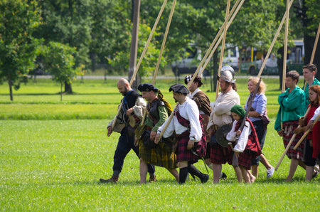 PETERHOF- JULY 07: Reconstruction of knightly fight in Peterhof on July 07, 2013, SAINT-PETERSBURG, RUSSIA. The festival "Alexandrian roundabout" takes place in the Alexandria Park in Peterhof every summerのeditorial素材