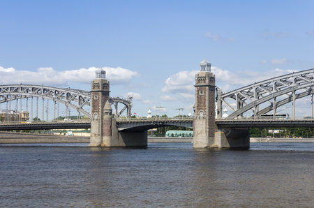 Bolsheokhtinsky bridge across Neva River in summer day, also known as Peter the Great Bridge,...