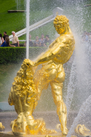 PETERHOF- JULY 07: Samson fountain of the Grand Cascade on July 07, 2013, Saint-Petersburg, Russia. The park ensemble of Peterhof belongs to the world heritage of UNESCOのeditorial素材