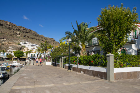 PUERTO DE MOGAN, GRAN CANARIA, CANARY ISLANDS - JANUARY 04, 2014: Quay with shops and restaurants in Puerto de Mogan, a small fishing port and resort on Gran Canaria Island, Spainのeditorial素材