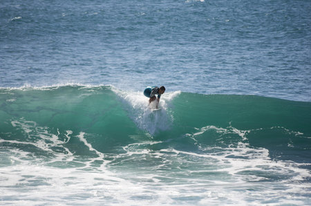 GRAN CANARIA, CANARY ISLANDS - JANUARY 05, 2014: Unidentified man surfing on a large wave on Playa...