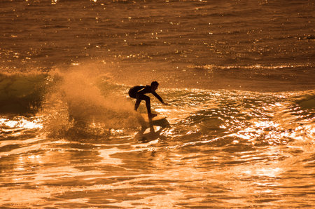 GRAN CANARIA, CANARY ISLANDS - JANUARY 05, 2014: Unidentified man surfing on a large wave on Playa...