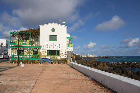 PUNTA MUJERES, LANZAROTE, CANARY ISLANDS - JANUARY 10, 2014: Typical white houses of village Punta...
