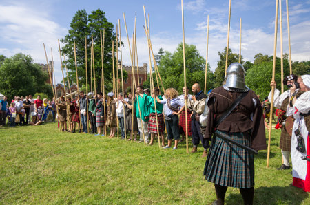 PETERHOF- JULY 07: Reconstruction of knightly fight in Peterhof on July 07, 2013, SAINT-PETERSBURG, RUSSIA. The festival "Alexandrian roundabout" takes place in the Alexandria Park in Peterhof every summerのeditorial素材
