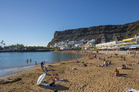 PUERTO DE MOGAN, GRAN CANARIA, CANARY ISLANDS - JANUARY 04, 2014: Quay with shops and restaurants in Puerto de Mogan, a small fishing port and resort on Gran Canaria Island, Spainのeditorial素材