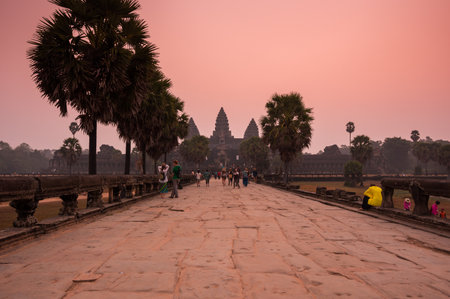 ANGKOR WAT, CAMBODIA - JANUARY 28, 2015: Tourists waiting for dawn at Angkor Wat temple in Cambodia. Angkor Wat is the largest Hindu temple complex and religious monument in the worldのeditorial素材