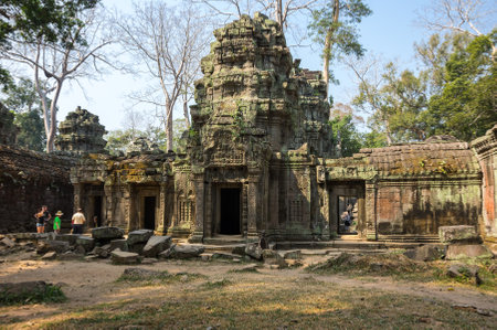 ANGKOR WAT, CAMBODIA - JANUARY 29, 2015: Unidentified tourists at Ta Prohm temple in Angkor Wat. Angkor Wat is the largest Hindu temple complex and religious monument in the worldのeditorial素材