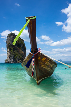CRABI PROVINCE, THAILAND - FEBRUARY 02, 2015: Traditional thai long tail boats waiting for tourist to travel to beautiful islands in Thailandのeditorial素材