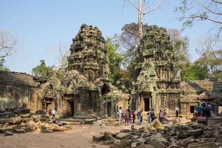 ANGKOR WAT, CAMBODIA - JANUARY 29, 2015: Unidentified tourists at Ta Prohm temple in Angkor Wat. Angkor Wat is the largest Hindu temple complex and religious monument in the worldのeditorial素材