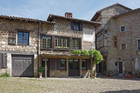 PEROUGES, FRANCE - 29 APRIL, 2015: Old stone houses at main square of medieval village Perouges in Franceのeditorial素材