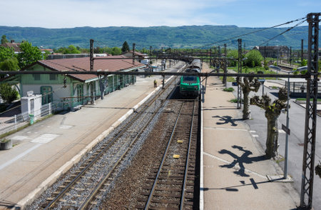 CULOZ, FRANCE - 30 APRIL, 2015: The train arriving at railway station in town Culoz, Haute Savoie province in Franceのeditorial素材