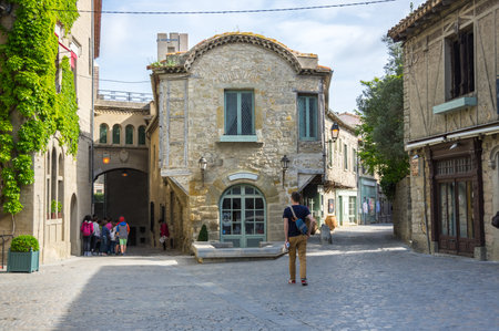 CARCASSONNE, FRANCE - MAY 05, 2015: Street with medieval houses in old town of Carcassonne, Languedoc-Roussillon, Franceのeditorial素材