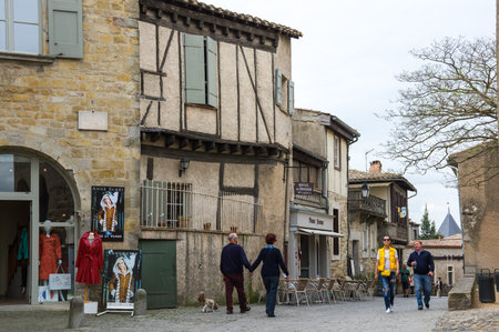 CARCASSONNE, FRANCE - MAY 05, 2015: Street with medieval houses in old town of Carcassonne, Languedoc-Roussillon, Franceのeditorial素材