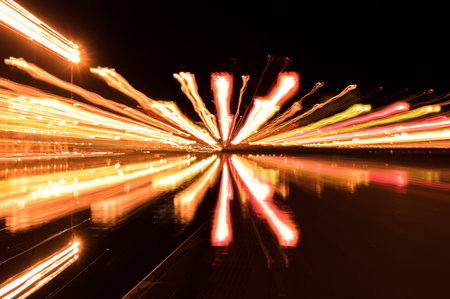 Abstract pattern of city lights from cars, windows, streetlights and bars