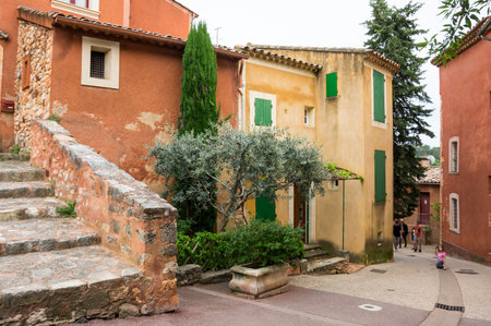 ROUSSILLON, FRANCE - MAY 03, 2015: Street of medieval village of Roussillon. It ochre village is included in list of "The most beautiful villages of France"のeditorial素材