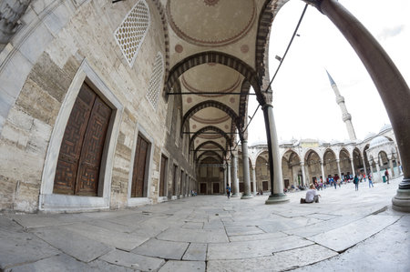 ISTANBUL, TURKEY - JUNE 19, 2015: People visiting Sultan Ahmet Mosque in Istanbul, Turkey. The mosque is popularly known as the Blue Mosque for the blue tiles adorning the walls of its interiorのeditorial素材
