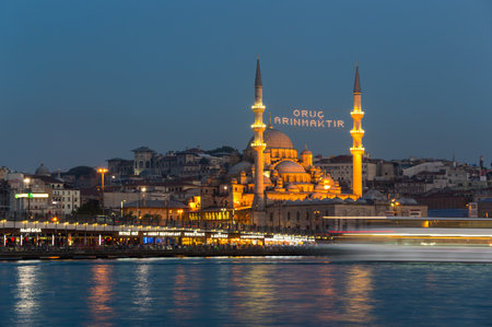 ISTANBUL, TURKEY - JUNE 20, 2015: Night view on Galata bridge and  New Mosque in Eminonu, Istanbul, Turkeyのeditorial素材