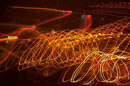 Abstract pattern of city lights from cars, windows, streetlights and bars